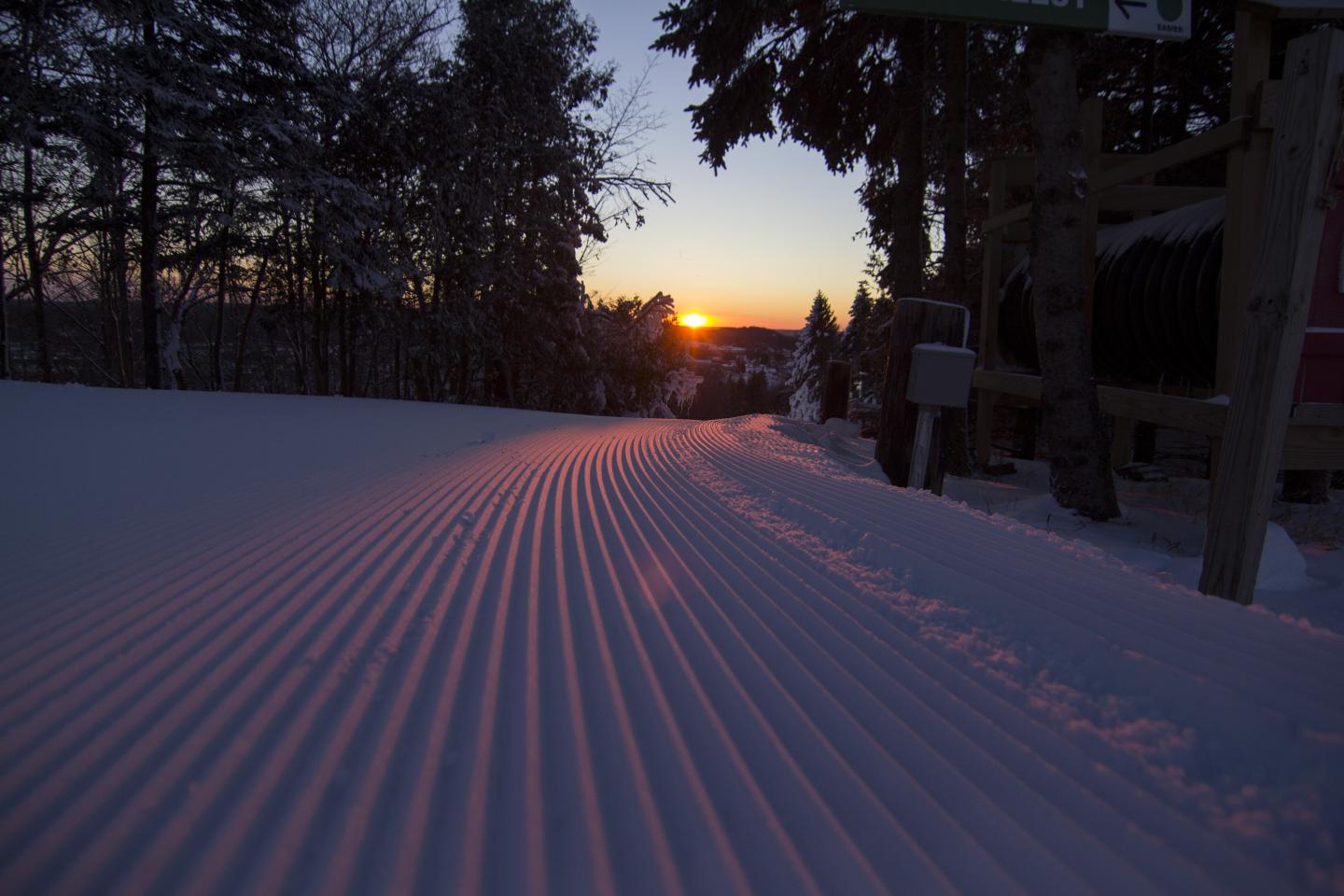 groomed run looking out over sun rise