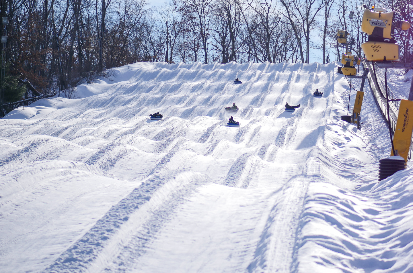 tubers riding down snow tube hill