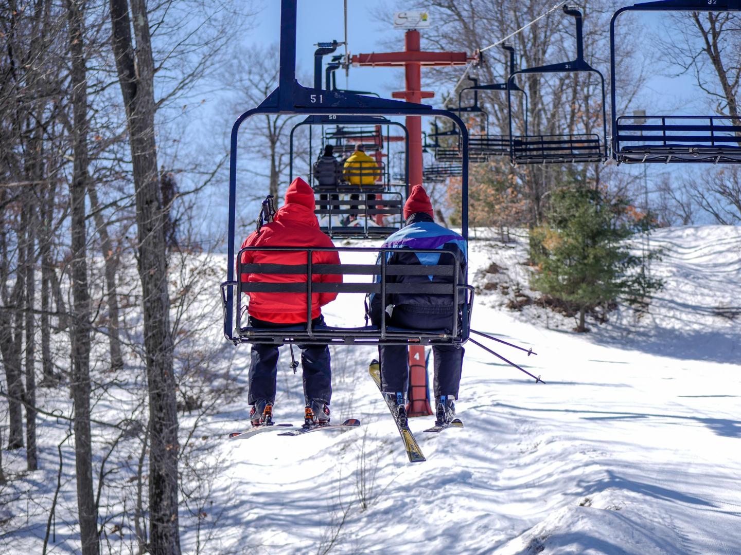 Skiers on chairlift