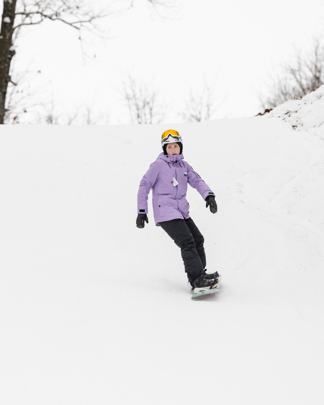 snowboarder going down hill